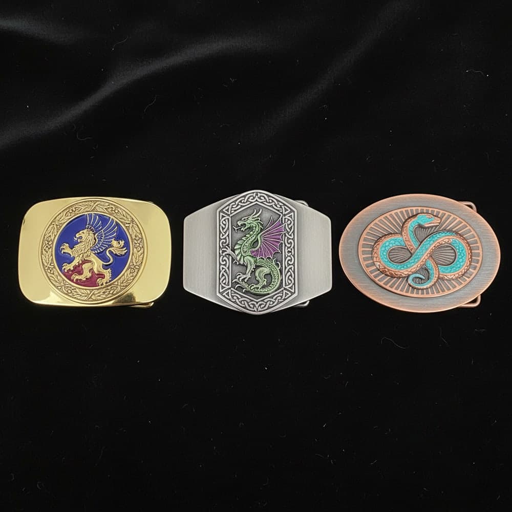 Collection of custom metal belt buckles in gold, silver, and two-tone finishes with enamel emblems