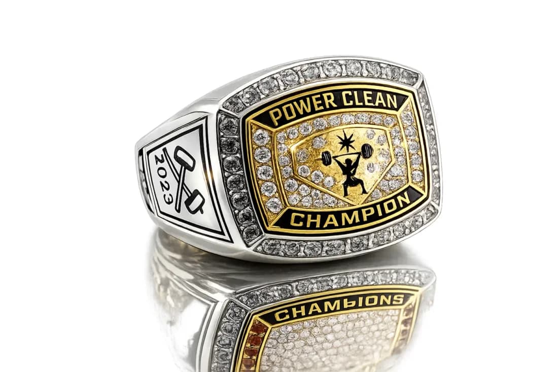 Finished custom championship ring by Colucci Custom Awards, shown here as a strength champion ring. Your own artwork replaces the design shown.