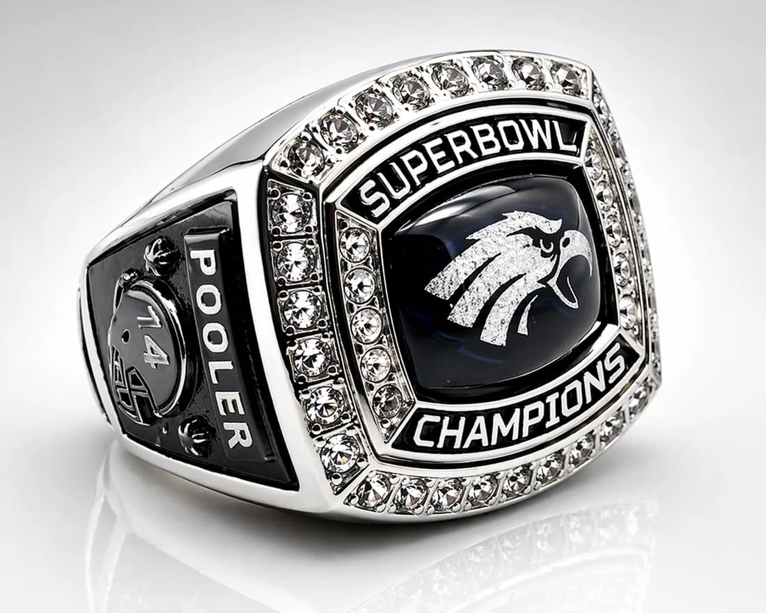 Youth Football Champion Rings by Colucci Custom Awards — a finished ring photographed in the workshop