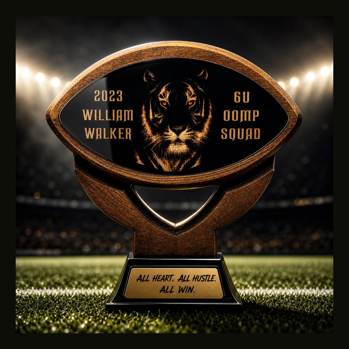Elite custom football-shaped trophy with team branding and engraved base