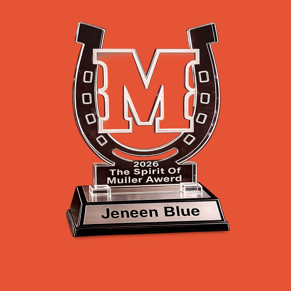 Custom horseshoe-shaped acrylic Spirit Award with a team monogram