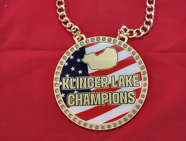 Elite bespoke iced-out championship chain with a stone-set champions medallion