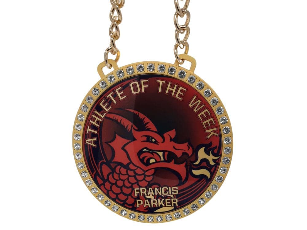 Custom MVP medallion chain with a round stone-set player award medallion on a gold chain